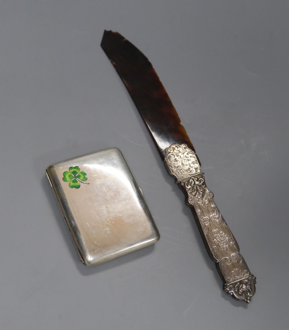 A Victorian silver handled tortoiseshell letter opener(a.f.) 25.6cm and a white metal and enamelled cigarette case, 83mm.